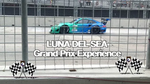 Green and blue race car on the street circuit.